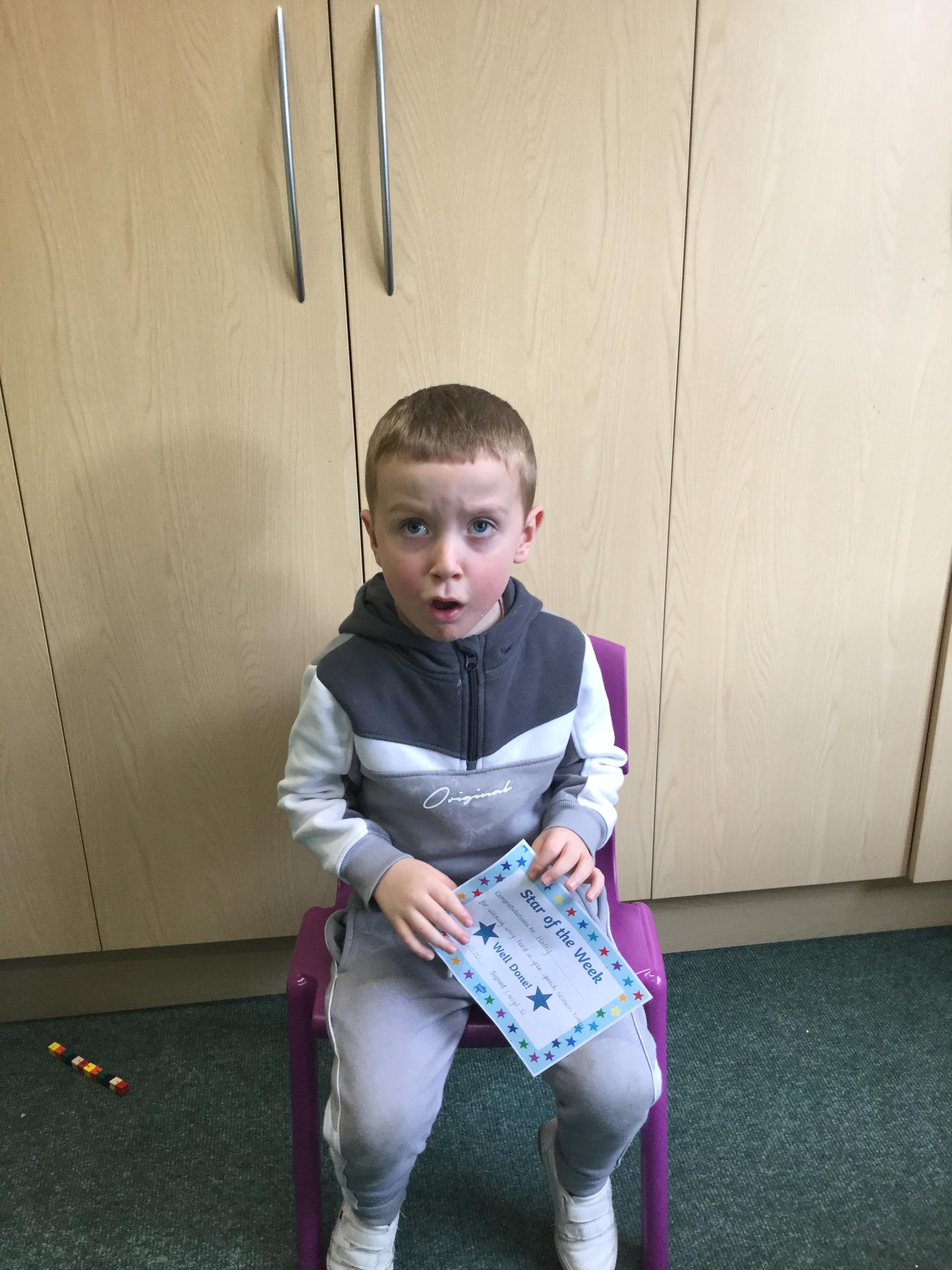 Harry wasn't happy just sat holding his certificate.